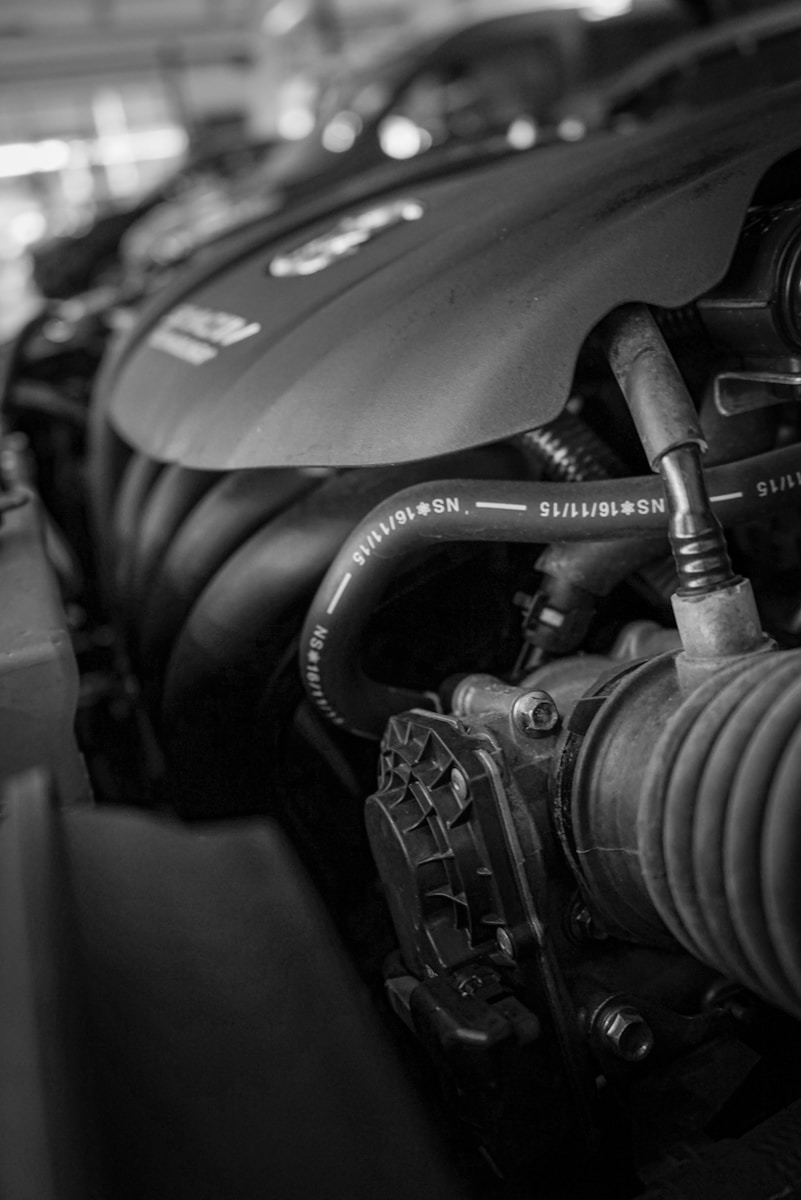 a black and white photo of a car engine